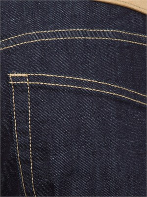 Jeans uomo PT Torino in denim scuro e linea carrot con piega stirata in UOMO